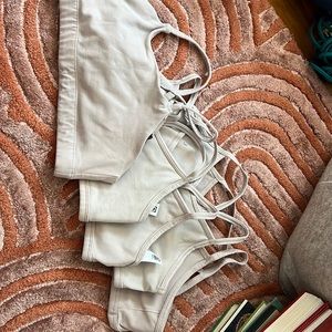 lot of 5 athleta girl sports bras; sizes 12 and 14